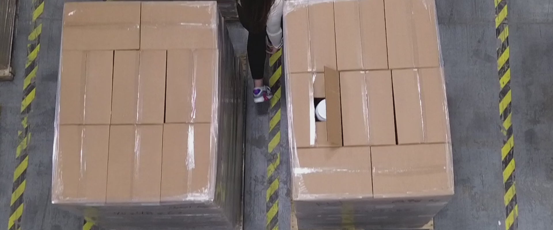 Video shot of ALT Founder walking through pallets in warehouse